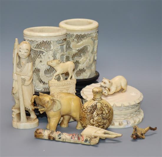 A Japanese carved ivory netsuke, a pair of pierced ivory vases, jar and cover, etc. (9)